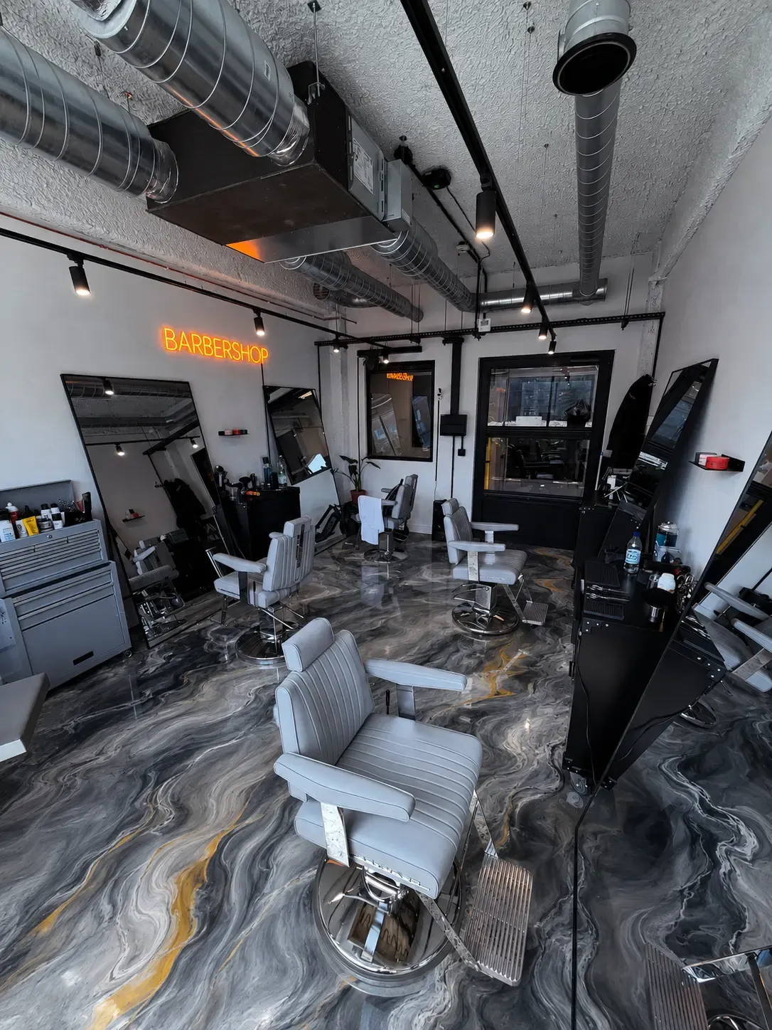 Example of a gray and white marbled metallic epoxy floor in a barbershop — Pomona, CA service area