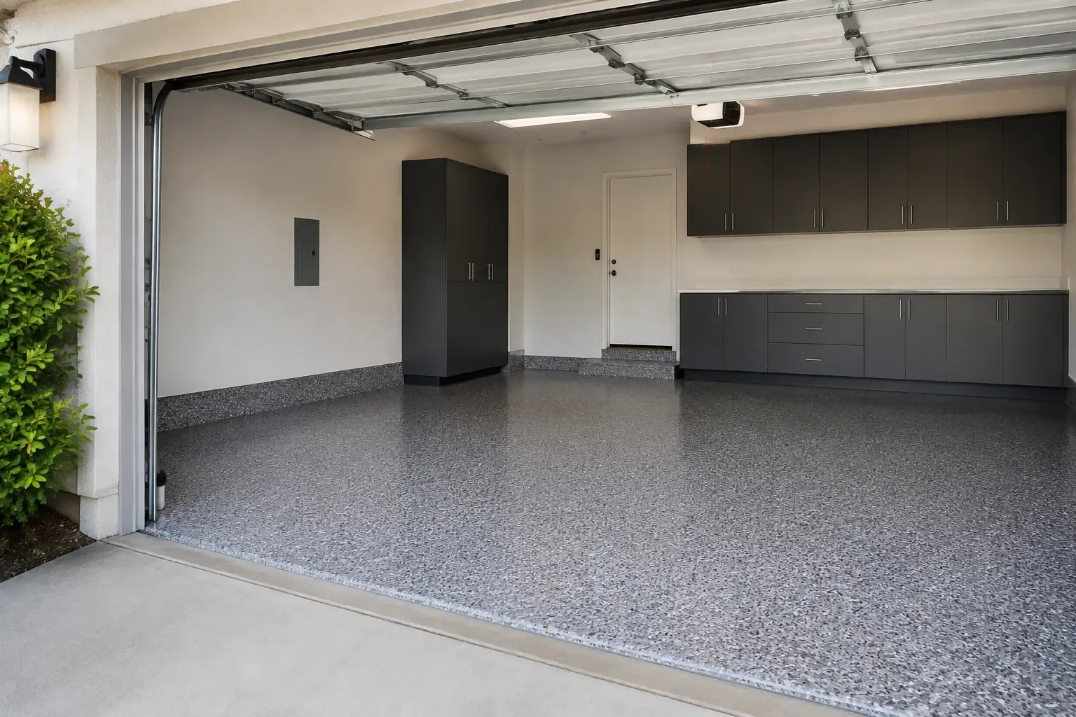 Example of a gray full-flake epoxy garage floor with a matching cove base — Upland, CA service area